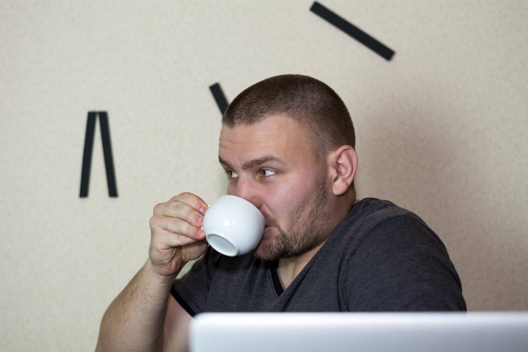 Home Young man drinks coffee. Student drinks coffee. More of my photos and videos Adobe Stock:http://bit.ly/3RqlciK More of my photos and videos Shutterstock: https://www.shutterstock.com/g/ALEKSANDRBERDYUGIN My email: bermix999@gmail.com